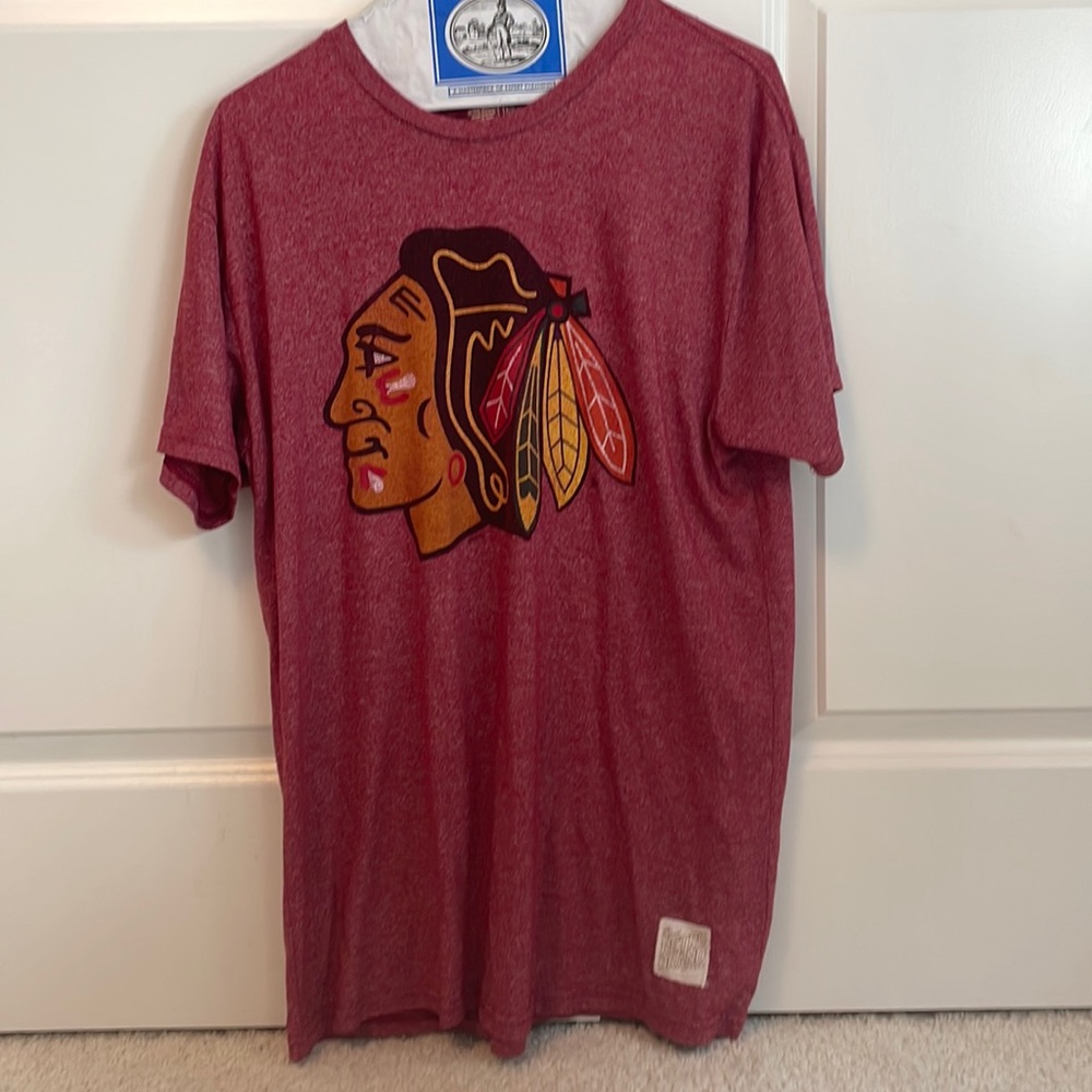 A black hawks shirt